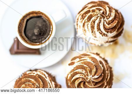 Black Coffee With Cupcakes And Muffins. Spice Cupcakes With Creamcheese Frosting Decorated With A Co