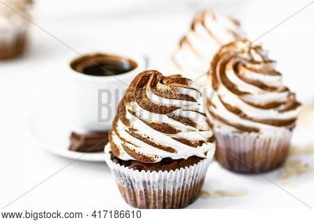 Black Coffee With Cupcakes And Muffins. Spice Cupcakes With Creamcheese Frosting Decorated With A Co