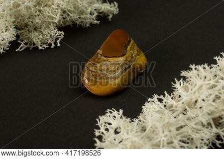 Tiger's Eye Stone From Republic Of South Africa Rsa. Natural Mineral Stone On Black Background. Mine