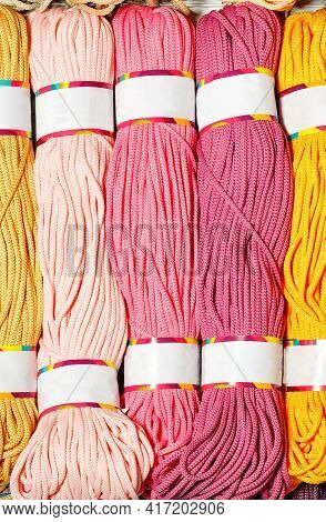 Rolls Of Polyester Cord In Various Colors Of Pink Shades, Rolled Into A Roll. Vertical Image, Close-