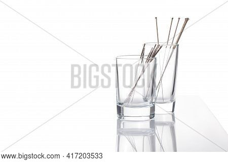Silver Needles For Traditional Chinese Medicine Acupuncture. Close-up. White Background. There Is So