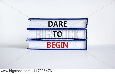 Dare To Begin Symbol. Books With Words 'dare To Begin'. Beautiful White Background. Business, Dare T