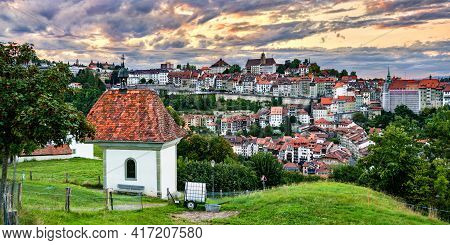 St. Jost Chapel In Fribourg, Switzerland At Sunset