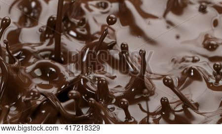Splashing hot chocolate texture, close-up.