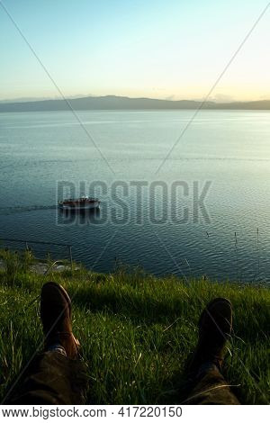 Selective Blur On Male Legs, Pants And Shoes With, In Background, Ohrid Lake, In Northern Macedonia,