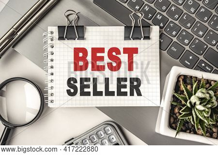 Best Seller Text On A Notepad And Laptop, Office Tools. Business, Financial Concept. Remote Training