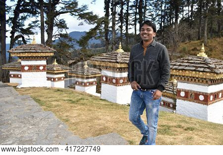 Happy Man Walking On Dochula Pass, Bhutan, On Mountains Cliff . Lifestyle Travel Emotional Success C