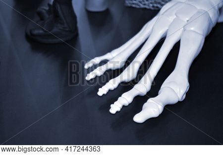 White Prototype Of The Human Foot Skeleton Printed On 3d Printer On Dark Surface