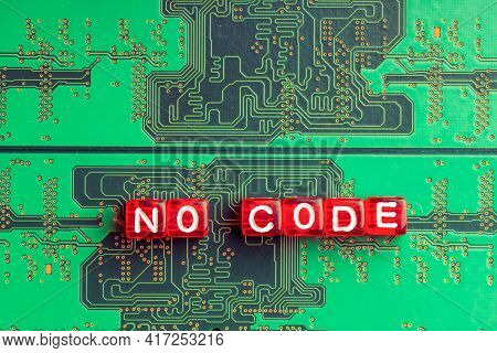No Code Inscription On A Green Microcircuit, Red Cubes On Green Simplification Of Programming