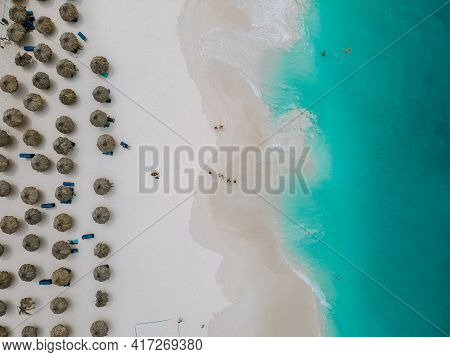 Aerial From Eagle Beach On Aruba In The Caribbean, Bird Ey View At The Beach With Umbrella At Aruba 