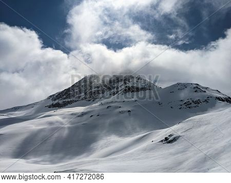 View Of The Cloud-covered Fanellhorn In The Canton Of Graubunden. Great Ski Tour Above Valles. Swiss