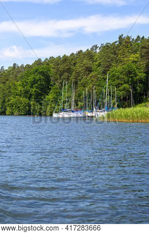 Masuria, Poland - June 24, 2020: A Typical Yacht Marina On The Masurian Lakes, Yachts Moored At The 