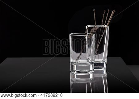 Silver Needles For Traditional Chinese Medicine Acupuncture. Close-up. Isolated On Black Background.