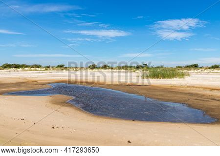 Sand And Lake With Blue Sky In Lagoa Dos Barros Lake, Osorio, Rio Grande Do Sul, Brazil