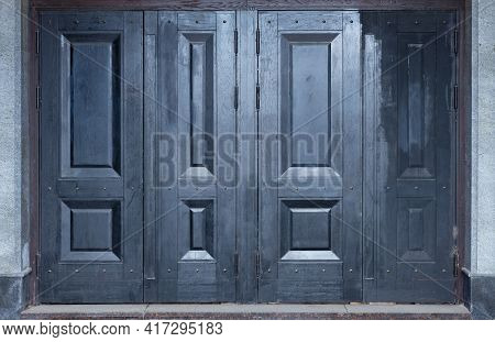 A Grey And Blue Wooden Street Doors. Four Doors All Together.