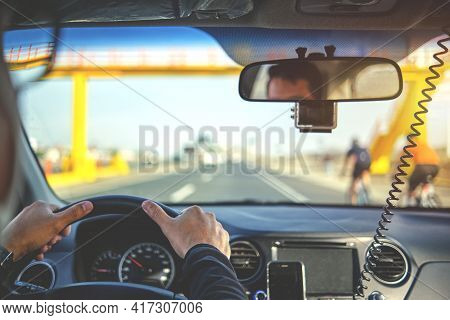 Driver Escorting Cyclists Training On The Highway, Protector Of Athletes. Group Of Professional Cycl