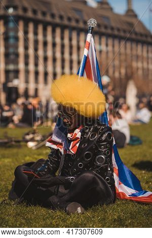 Westminster, London | Uk -  2021.04.17: Beautiful Stylish Person Waving The Union Jack Flag At The K