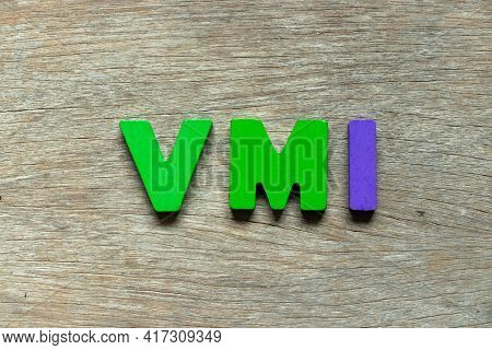 Color Alphabet Letter In Word Vmi (abbreviation Of Vendor Managed Inventory) On Wood Background