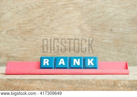 Tile Alphabet Letter With Word Rank In Red Color Rack On Wood Background