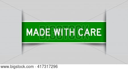 Inserted Green Color Label Sticker With Word Made With Cae On Gray Background