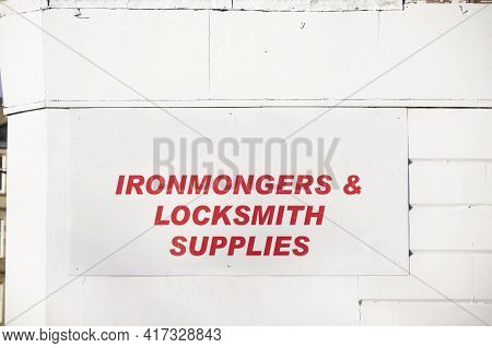 Ironmongers And Locksmith Supplies Sign On Wall