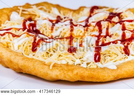 Langos Stuffed With Grated Cheese And Dressing.langos Is A Traditional Hungarian Food. Food Styling 