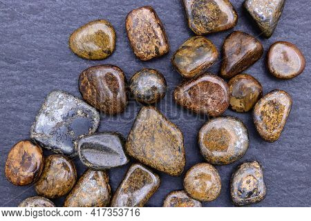 Bronzite Heap Up Jewel Stones Texture On Black Stone Background