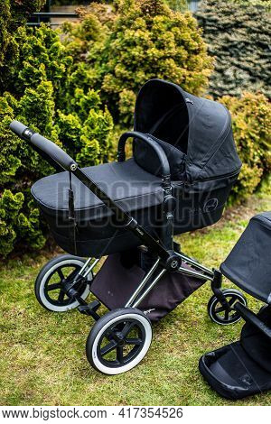 Budapest, Hungary - April 18, 2021: Cybex Priam Black Stroller Or Pram In The Park. Infant Carriage