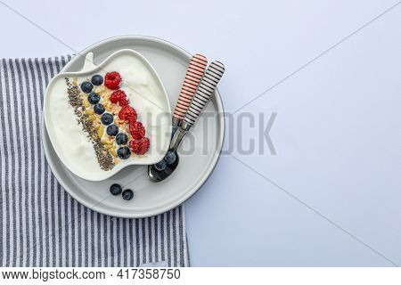 Fresh Yogurt With Fruits, Granola, Chia Seeds Und Napkin