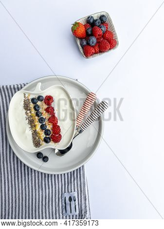 Fresh Yogurt With Fruits, Granola, Chia Seeds Und Napkin