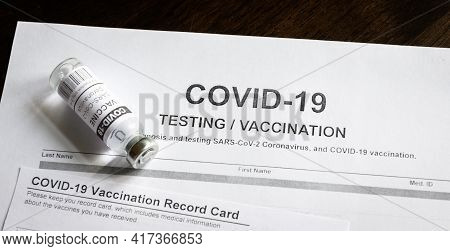 Covid-19 Test And Vaccine Medical Form In Clinic. Panoramic Top View Of Coronavirus Vaccination Cert