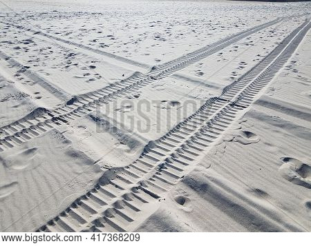 Tire Tracks On Sand On The Beach Or Shore