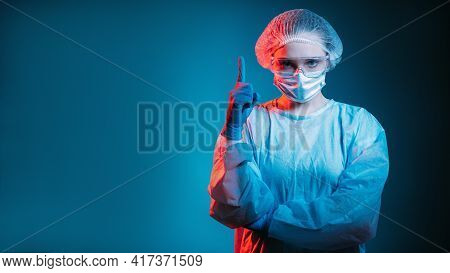 Medical Warning. Covid-19 Restriction. Pandemic Alert. Portrait Of Strict Female Doctor In Ppe Face 