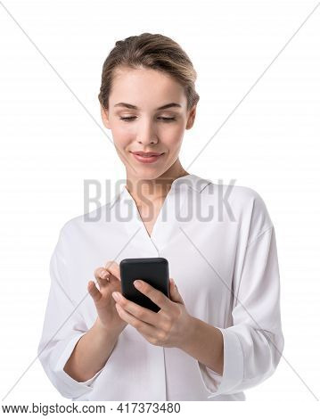 Office Blonde Woman In White Shirt, Business Clothes, Using Smartphone In Hands, Smiling. Concept Of