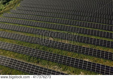 Solar Panels In Aerial View. Posolar Panels In Aerial View. Power Farm Producing Clean Energy.wer Fa