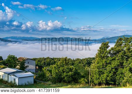 Foggy Morning View From The Hills Of San Capone To The Sibillini Mountains Park In Italy, Europe