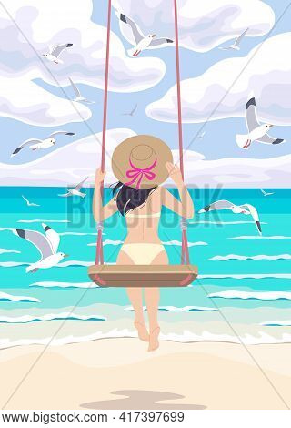 Young Woman In Straw Hat Swinging On Swing At The Sea Coast. Girl In Swimsuit Back View. Vacation Co