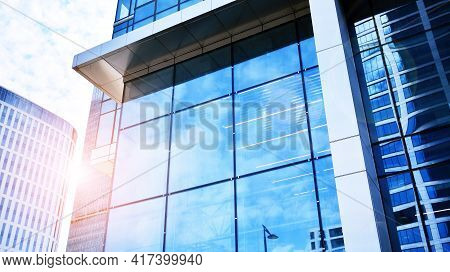 Downtown Corporate Business District Architecture. Glass Reflective Office Buildings Against Blue Sk