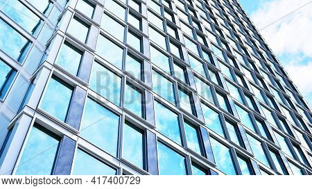 Abstract Closeup Of The Glass-clad Facade Of A Modern Building Covered In Reflective Plate Glass. Ar