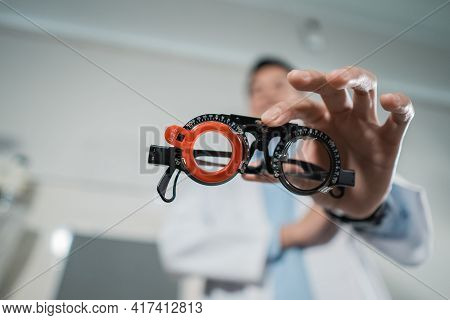 A Trial Frame Is Being Held By A Doctor