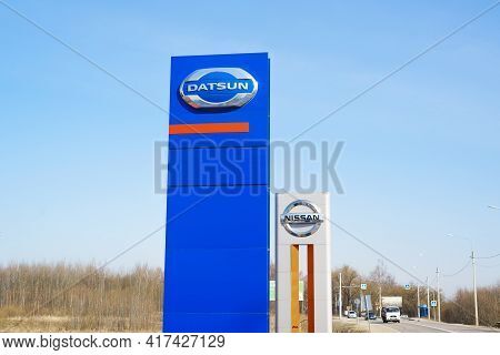 The Logo Of The Japanese Carmaker Company Datsun And Nissan, Outside By The Road. Smolensk, Russia 0
