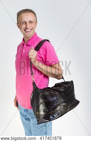 Modern Lifestyle Concepts. Portarit Of Positive Smiling Caucasian Handsome Man Posing With Leather T