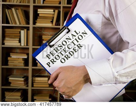 Man With Clipboard And Papers About Personal Protection Order Ppo.
