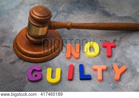 Judges Gavel And Letters From Plastic On The Table, Justice Concept.