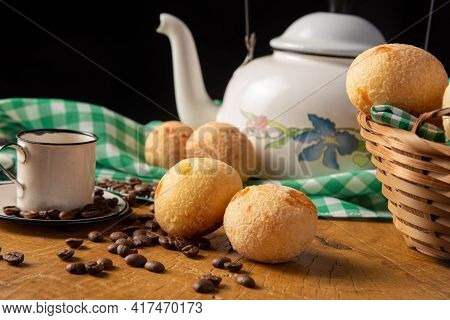 Coffee Table In Brazil In Details With Cups, Coffee Beans And Cheese Bread On Rustic Wood, With Gree