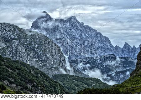 Wild Clouds Mountain Peak Ready For Mountaineering Hiking With Valley With Wood Forest