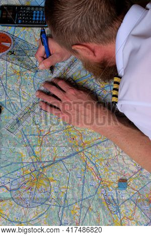Pilot Is Calculating His Navigation Route On An Actual Map 25.3.2021