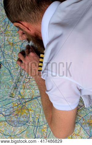 Pilot Is Calculating His Navigation Route On An Actual Map 25.3.2021
