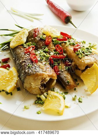 Baked Hake Fish With Herbs And Spices, Soy Sauce. Shallow Dof.
