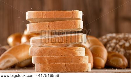 Falling sliced freshly baked toast bread.